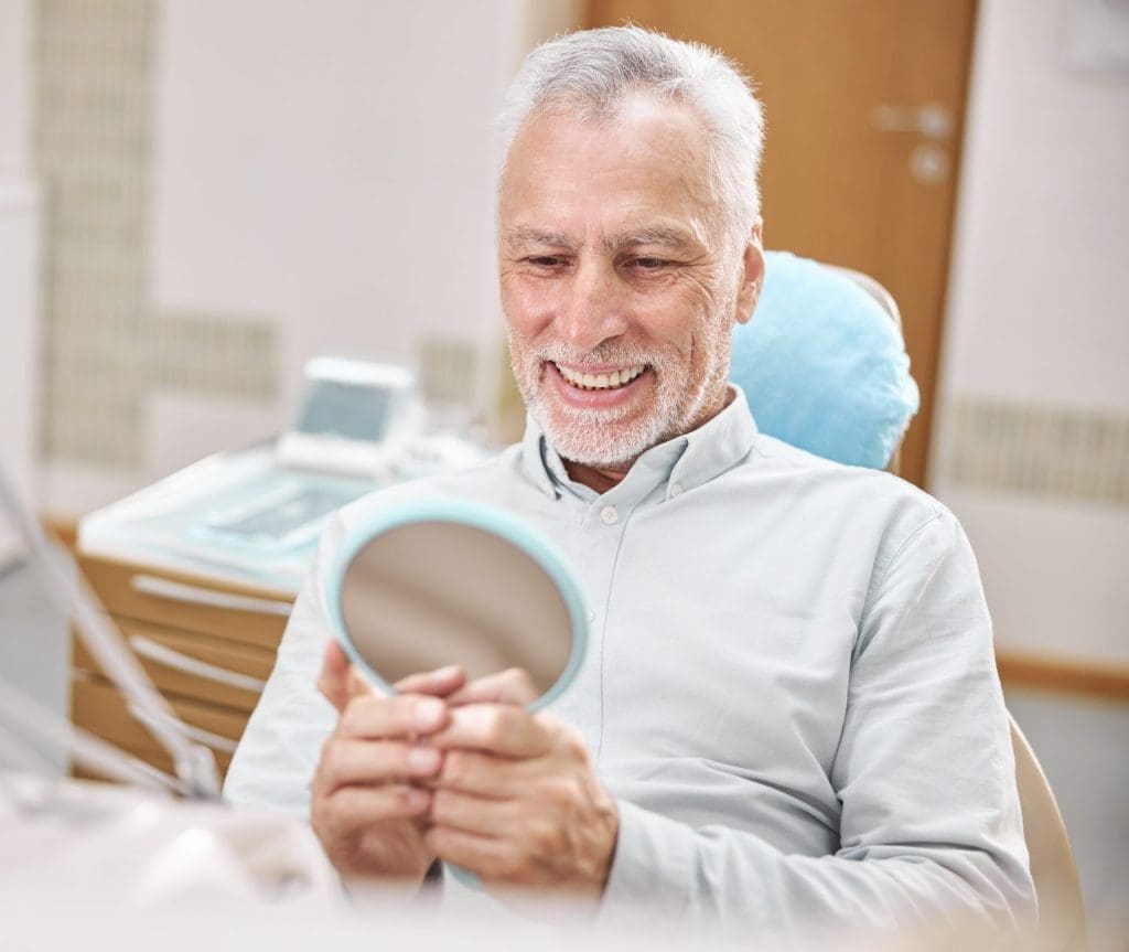 aging-gentleman-sitting-in-a-dental-chair